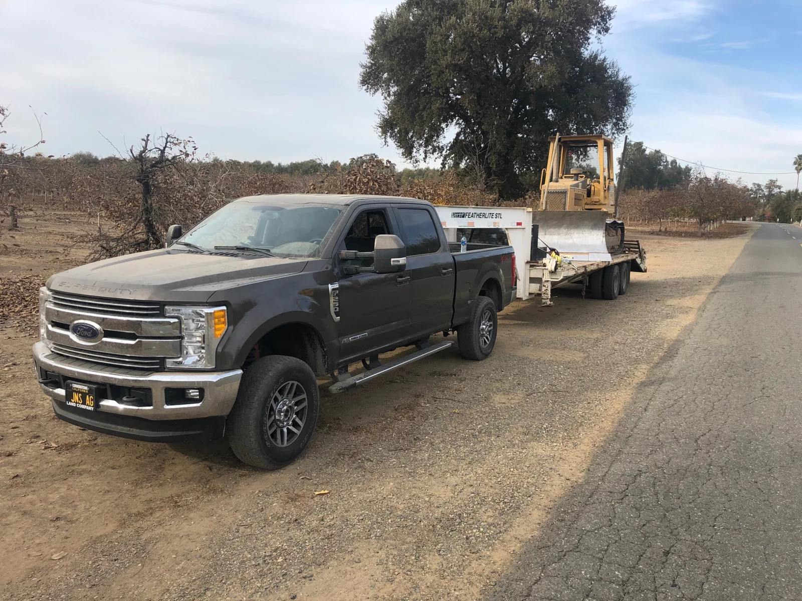 Rafter E truck transporting heavy equipment